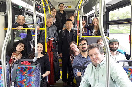 A group of PhD students and professors in the bus on their return to New York City from Lamont