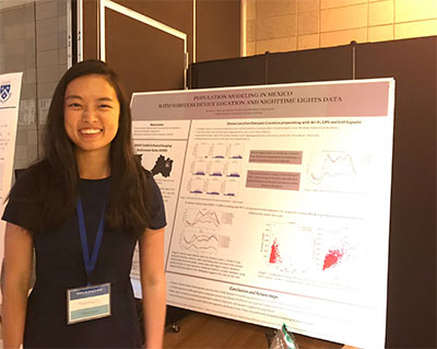 Nanshan Li standing in front of the poster she authored on modeling population change in Mexico using wireless device location and nighttime lights data